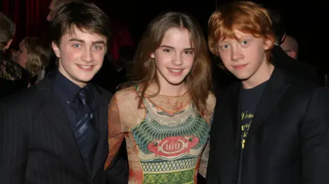 (Left to right) Daniel Radcliffe, Emma Watson and Rupert Grint pictured in 2003